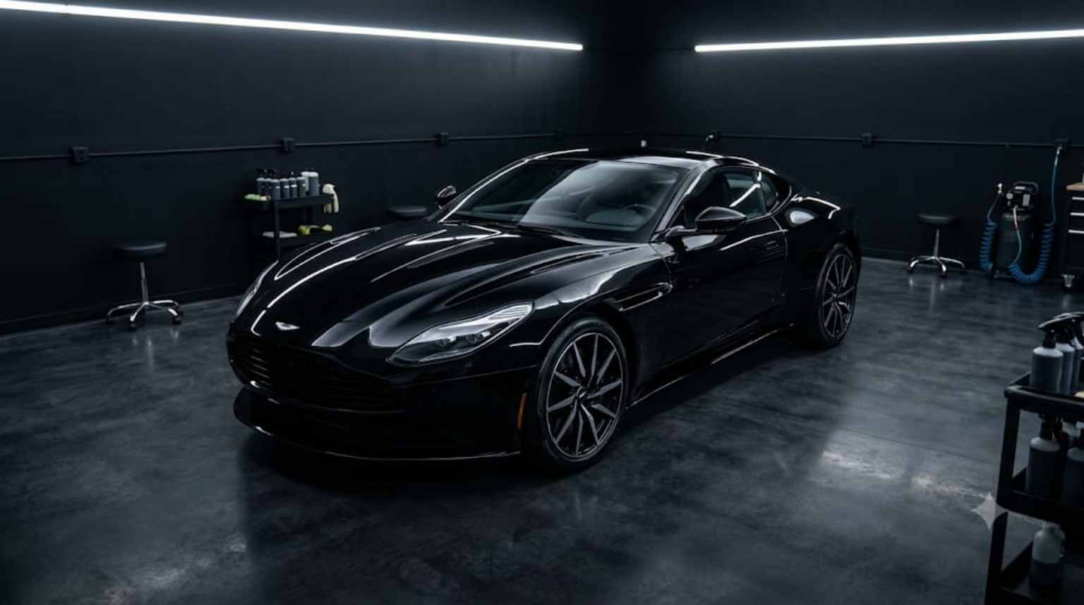 Aston Martin DB11 detailing exterior in LED-lit garage studio